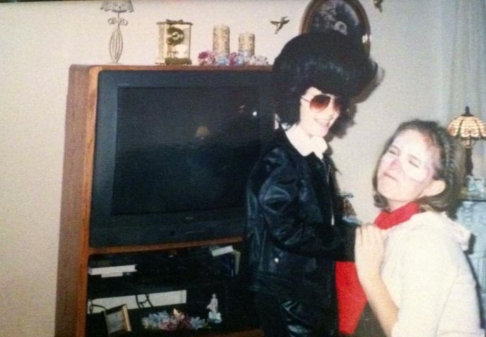 Ashley Dressed as Elvis Gives Melissa a Scarf